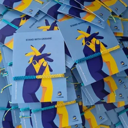 Blue and Yellow Bracelets Welcome Conference Delegates in Vilnius